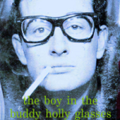 The Boy in the Buddy Holly Glasses